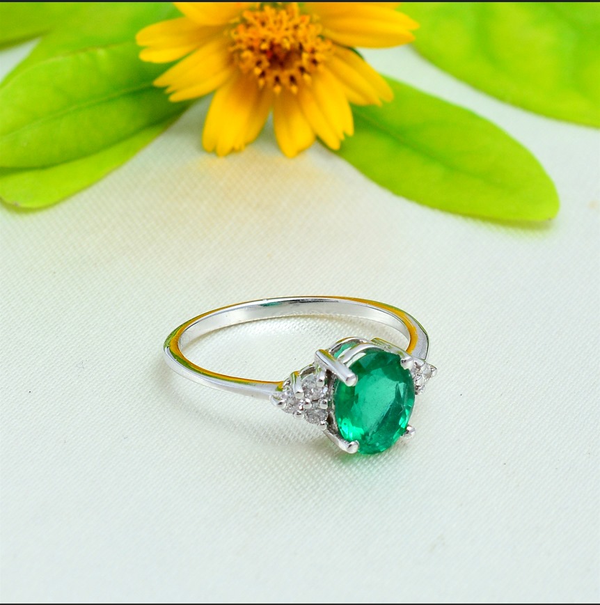 18KT White Gold Oval Emerald and Diamond Ring